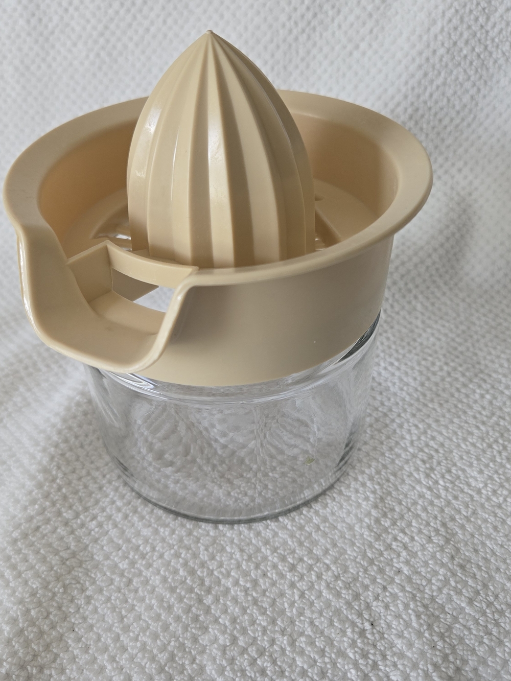Beige Plastic Citrus Juicer with Glass Base
